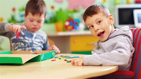 Occupational therapist working with a child with a disability