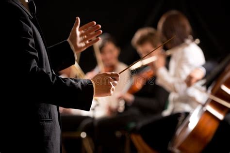 Conductor leading an orchestra