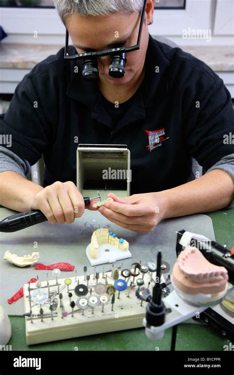 Dental lab technician working at a dental laboratory