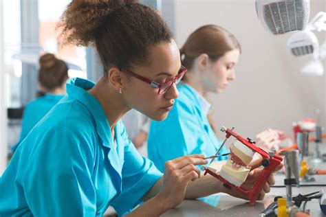 Dental lab technicians networking at a conference