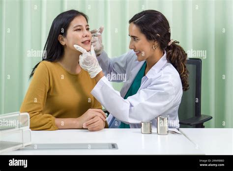 Dermatologist examining a patient's skin