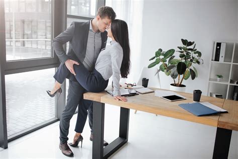 Couple having sex on the desk