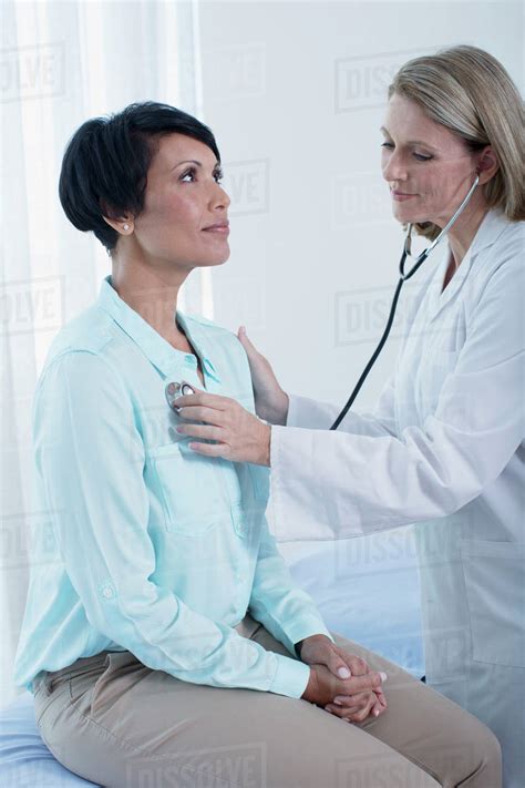 female doctor examining patient