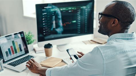 Financial analyst working on a computer