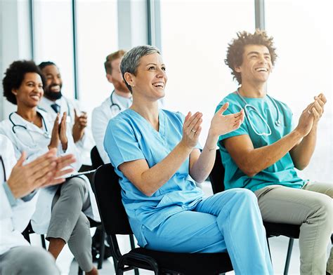 Home health care nurse educator teaching a class of nurses