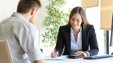 Insurance sales agent meeting with a client