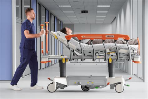 Patient Transporter pushing a patient in a wheelchair