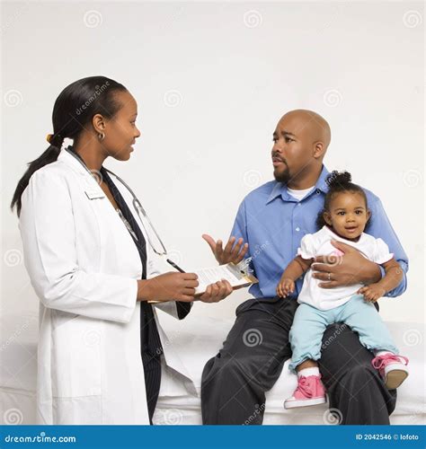 Pediatrician talking to parent