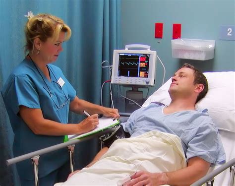 Pre-op nurse preparing patient for surgery