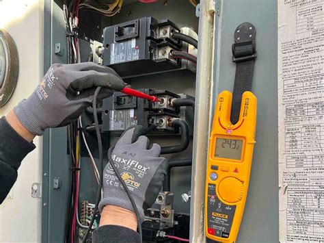 Residential electrician working on a house