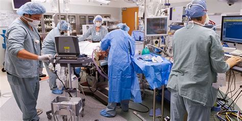 Surgical Technologist Providing Post-Operative Care